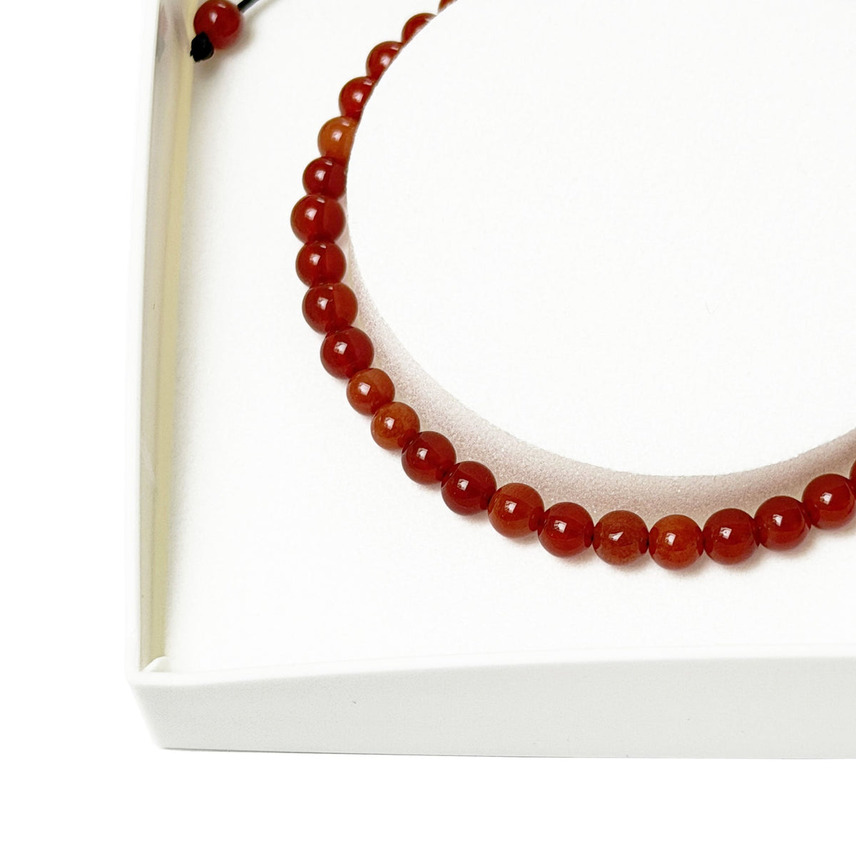 Bracciale in corniola – Perle sferiche da 4 mm cordoncino regolabile