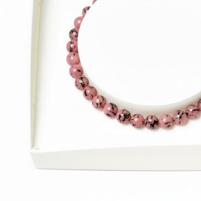 Bracciale in rodonite – Perle sferiche da 4 mm cordoncino regolabile