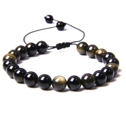Bracciale in Ossidiana dorata – cordino regolabile con pietre sferiche da 8 mm