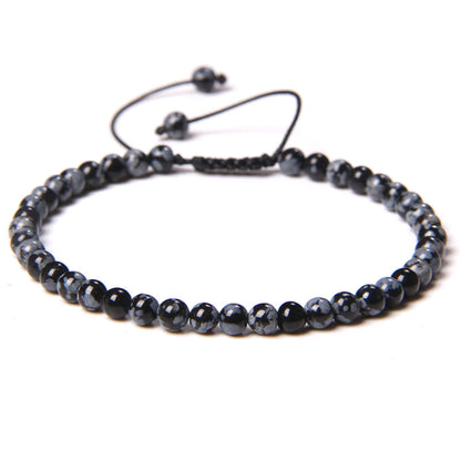 Bracciale in Ossidiana Neve – cordino regolabile con pietre sferiche da 4 mm